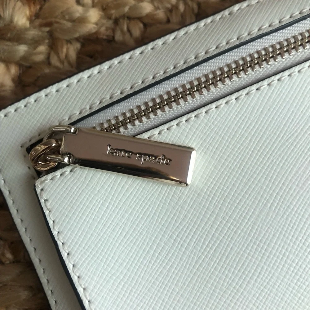 NWOT: Kate Spade Staci Slim Bifold Wallet. Saffiano Leather. Color is Parchment.